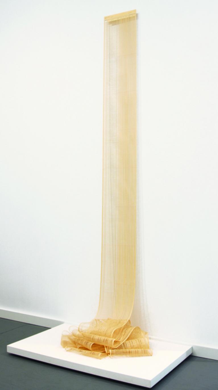 Untitled (Vertical Installation, Yellow) Hand-Cut Ledger Paper (Dimensions Variable - approx: 81.5”x 28”x 18”) 2010