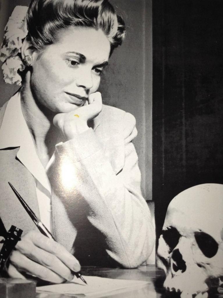 Natalie Nickerson considers a Japanese skull, LIFE magazine, May 22, 1944