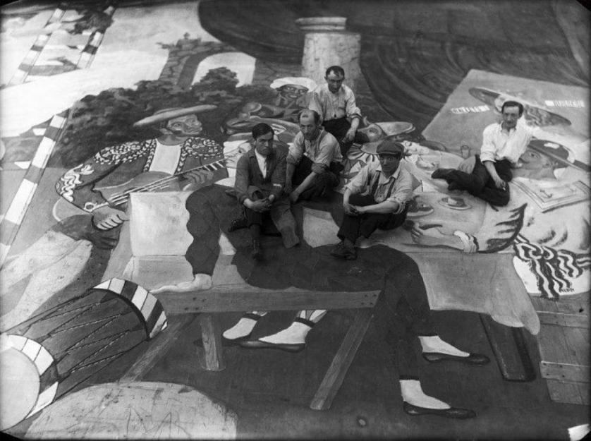 pablo-picasso-and-scene-painters-sitting-on-the-front-cloth-for-parade-photo-by-lachmann.jpg