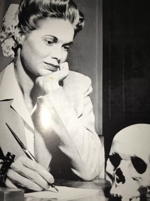 Natalie Nickerson considers a Japanese skull, LIFE magazine, May 22, 1944